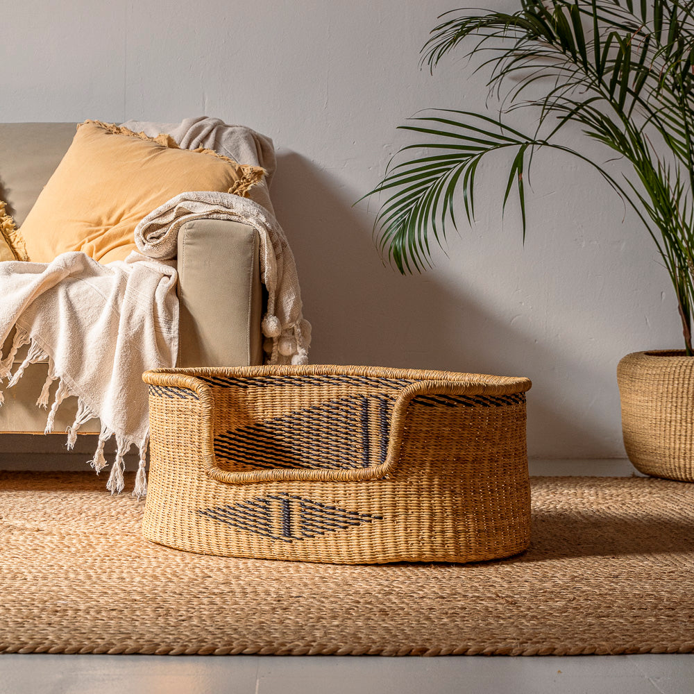 Dog bed made from elephant grass with a diamond shape design.  Made by Akan Republic.