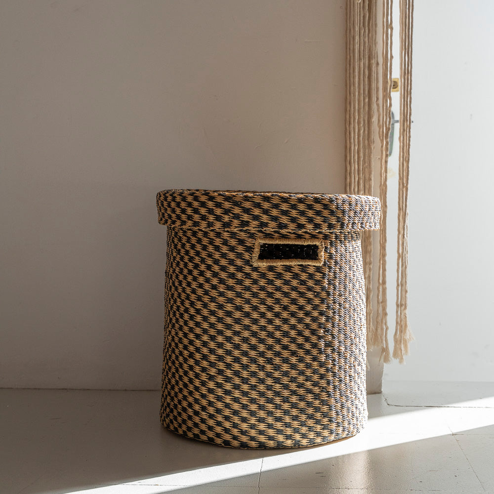 Laundry baskets with lids and also has handles. These baskets were designed by Akan Republic.